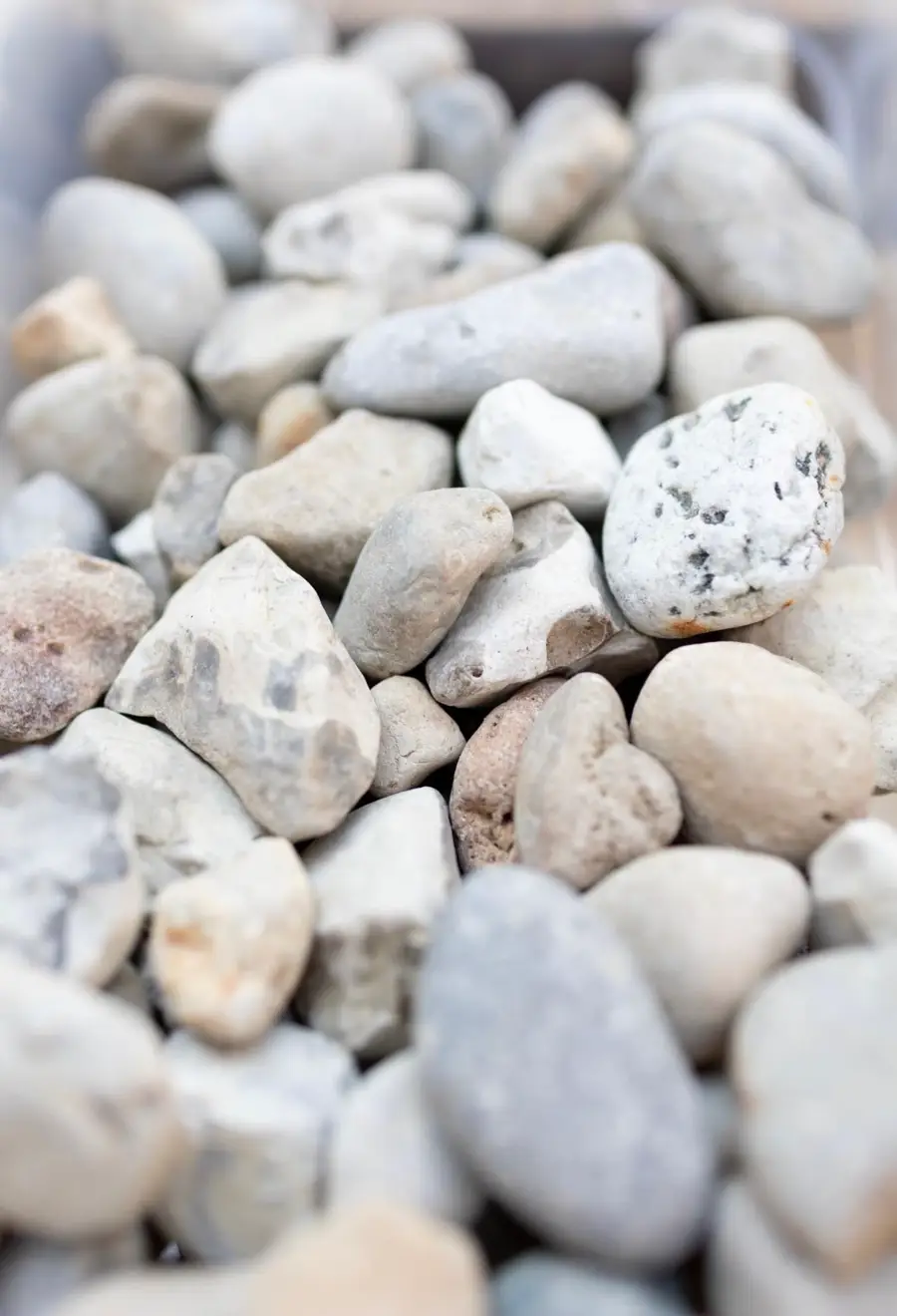 Close-up of smooth white and gray river rock
